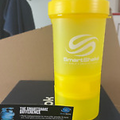 BRAND NEW SMARTSHAKE PROTEIN MIXER AND 2 SUPPLIMENT HOLDERS  600ML YELLOW